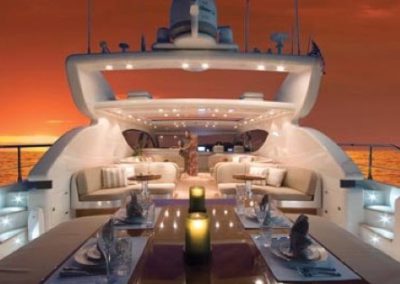80 Leopard yacht aft deck night dining